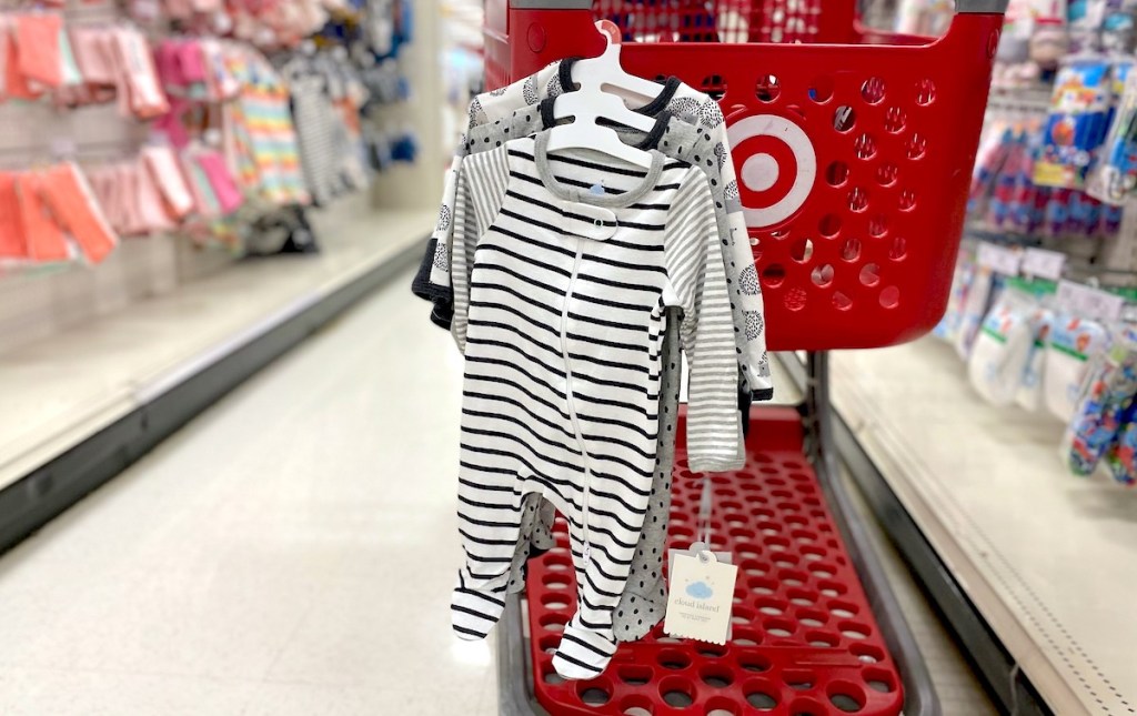 baby sleepers hanging from red target cart