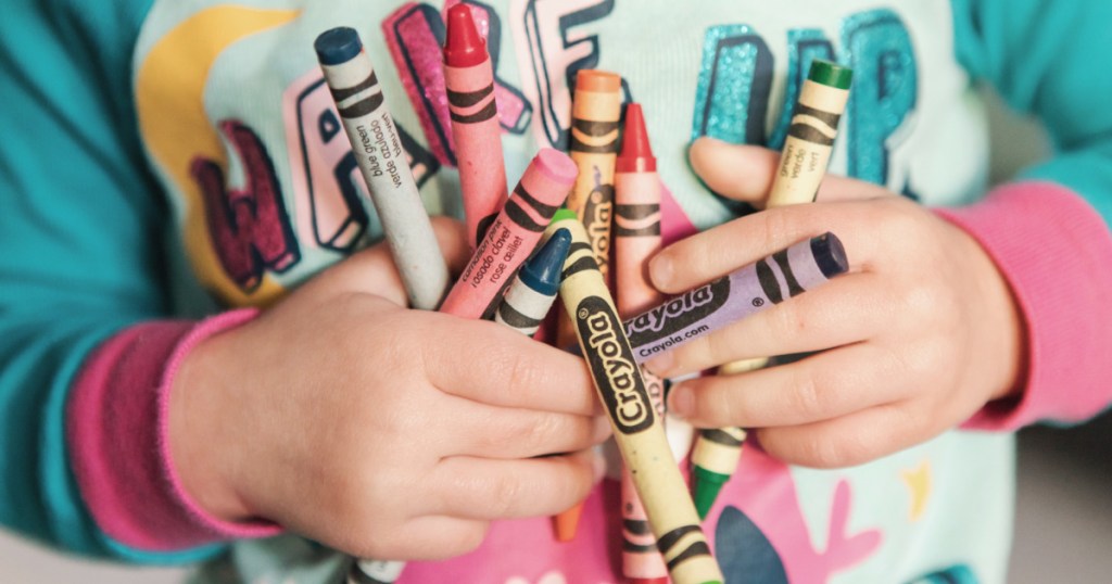 Kids hands filled with crayon