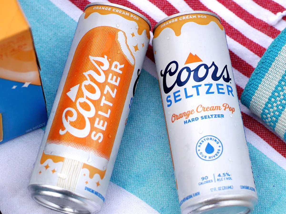 two cans of Coors Orange Cream Pop Seltzer