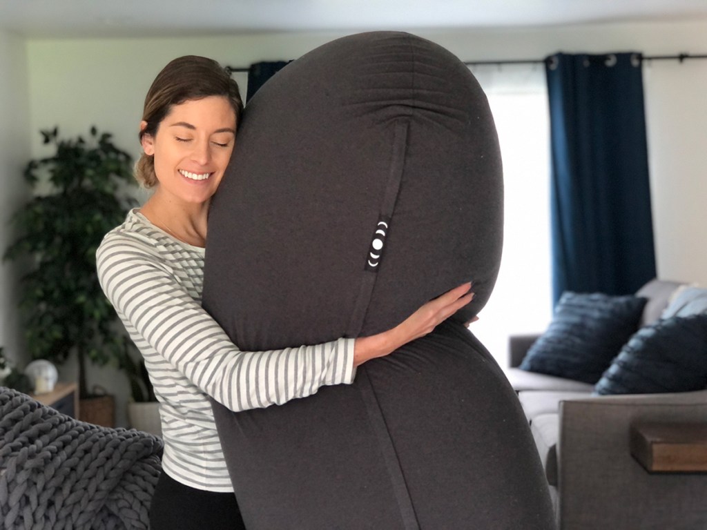 woman huggin moon pod bean bag chair