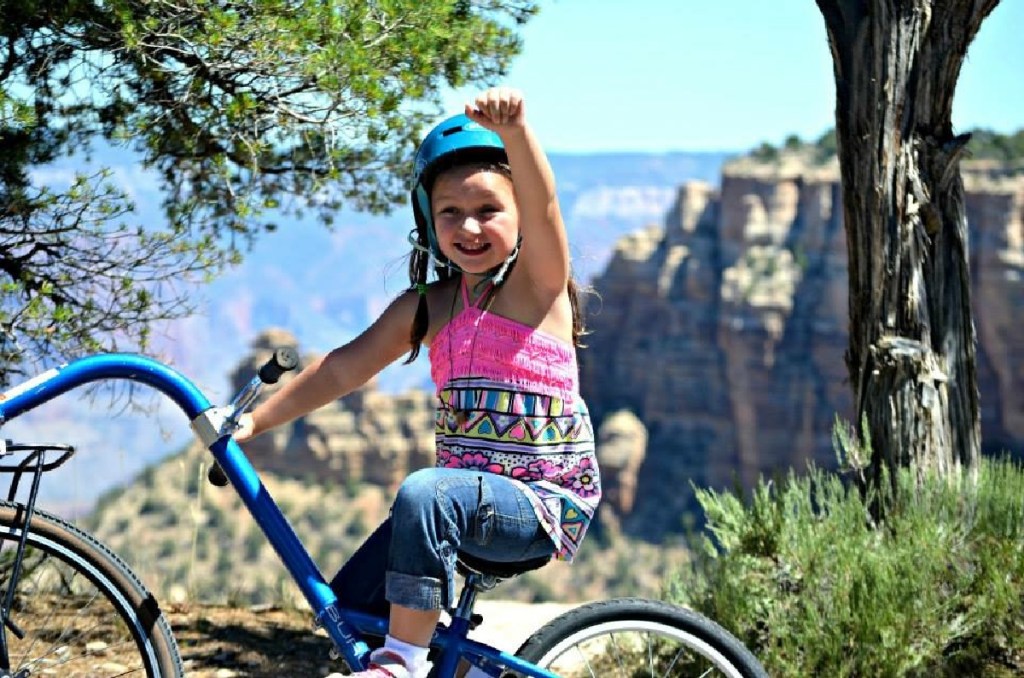 girl riding bike in grand canyon 