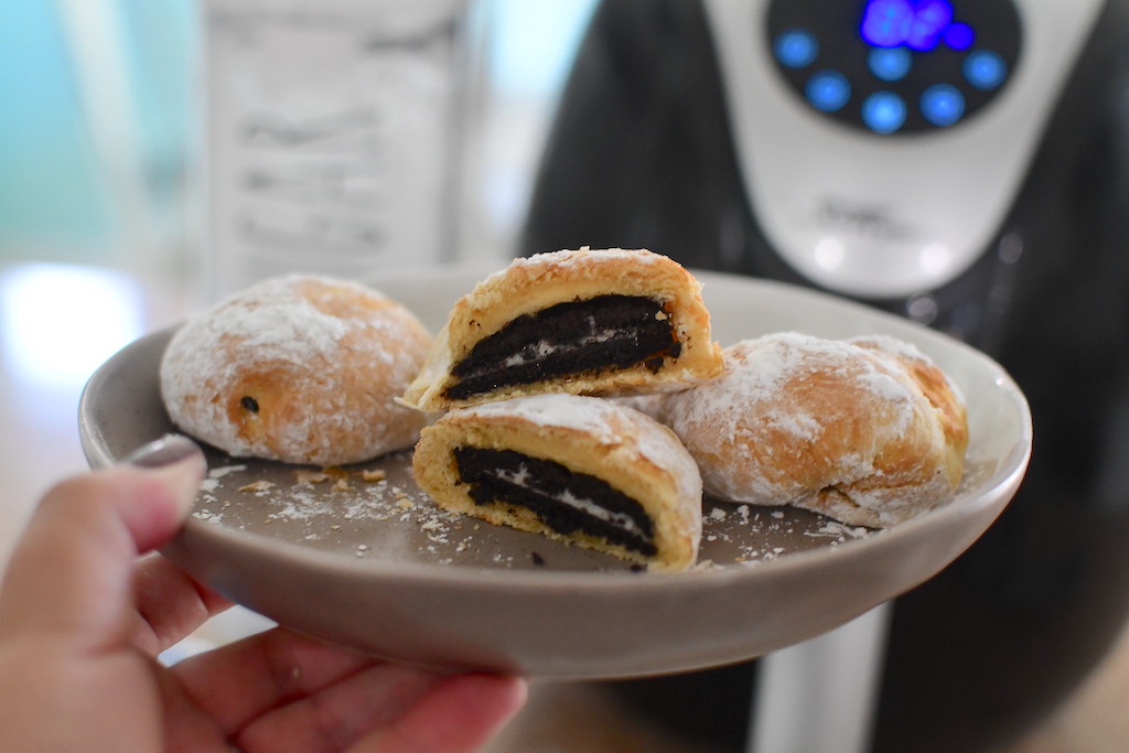 holding plate of air fryer fried oreos 
