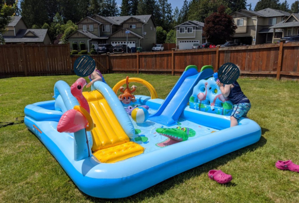 inflatable colorful kids pool with slide outside