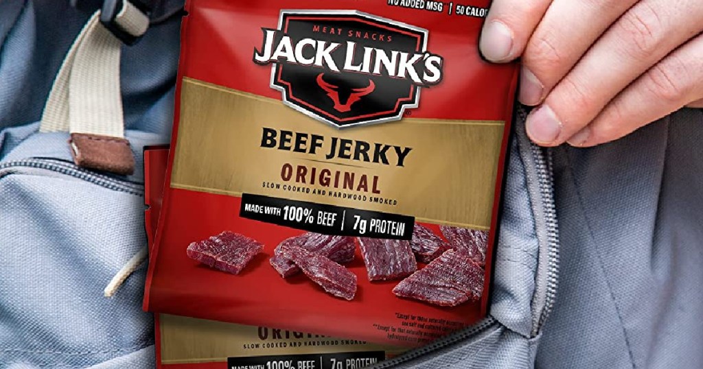 man pulling jack link's beef jerky bag out of pocket