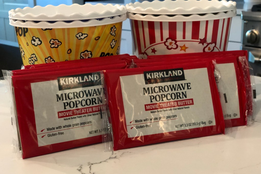 bags of kirkland microwave popcorn in front of popcorn bowls