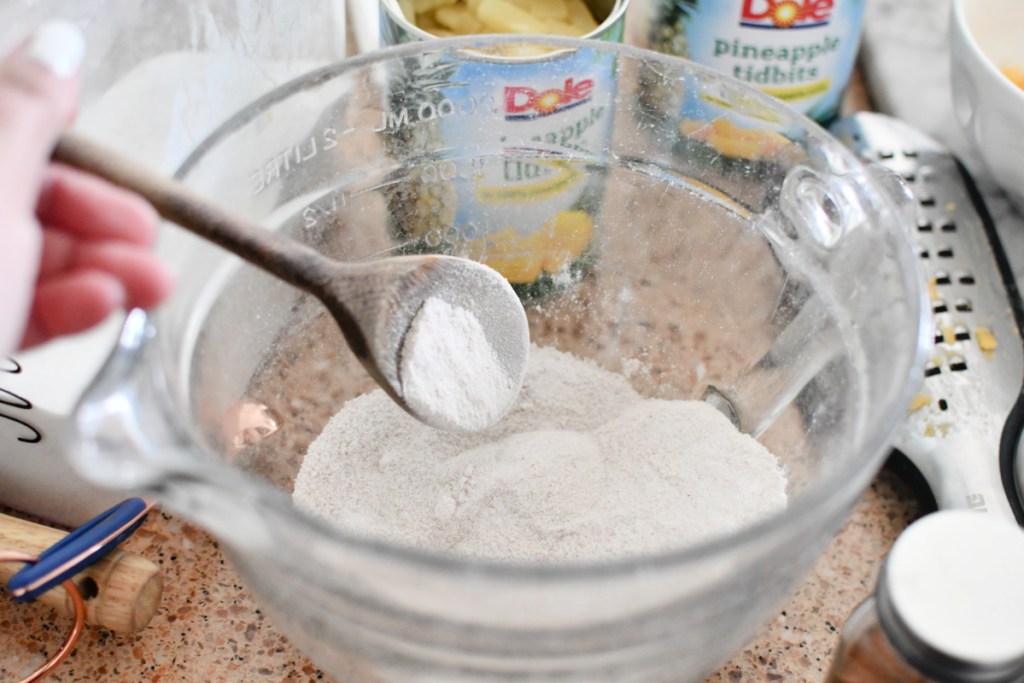 mixing flour and sugar in a mixing bowl
