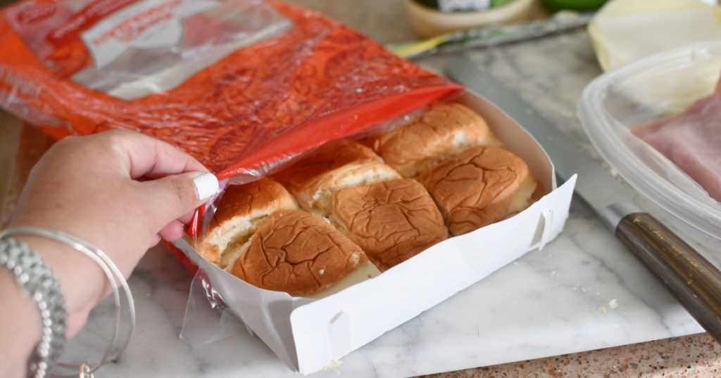 putting sandwiches back in hawaiian roll bag