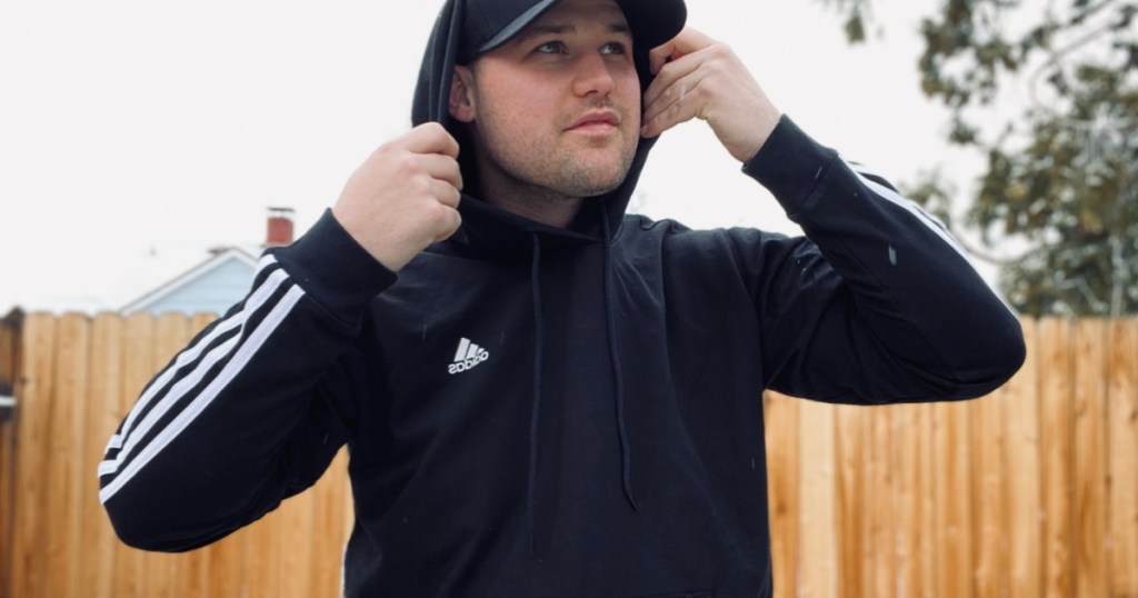 man wearing adidas hoodie