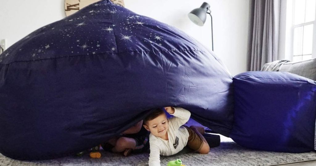 kid in an inflatable fort