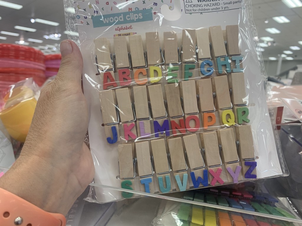 hand holding up Alphabet Clips