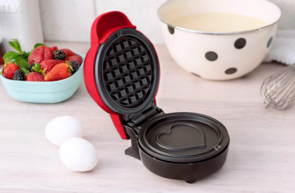 waffle maker with eggs next to it