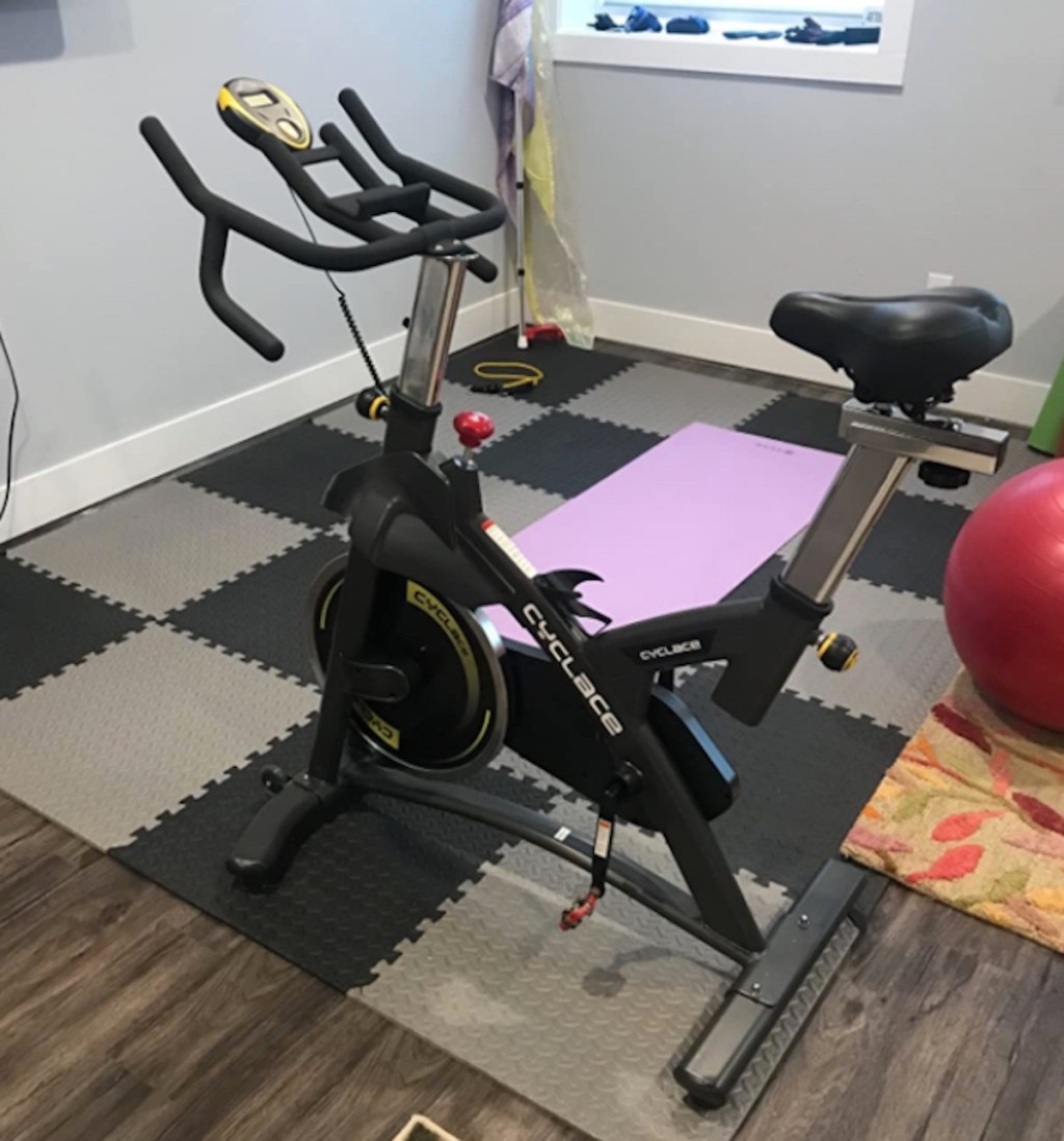 exercise bike on home gym checked mat