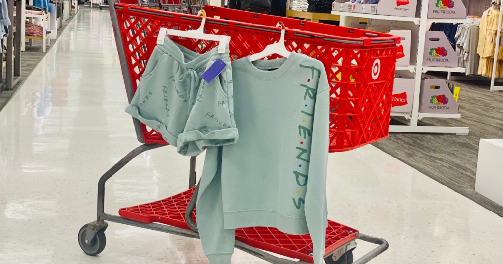 sweatshirt and shorts hanging on red target cart