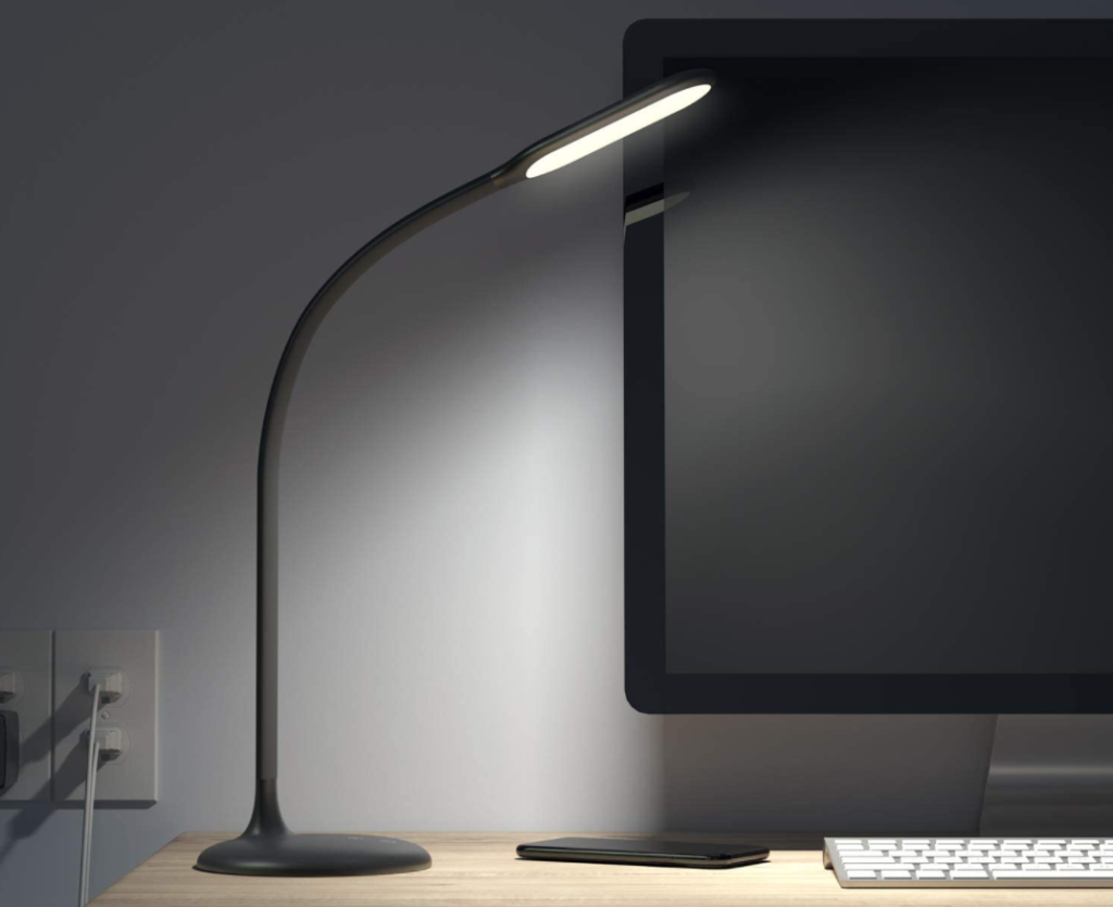 lamp sitting by a computer
