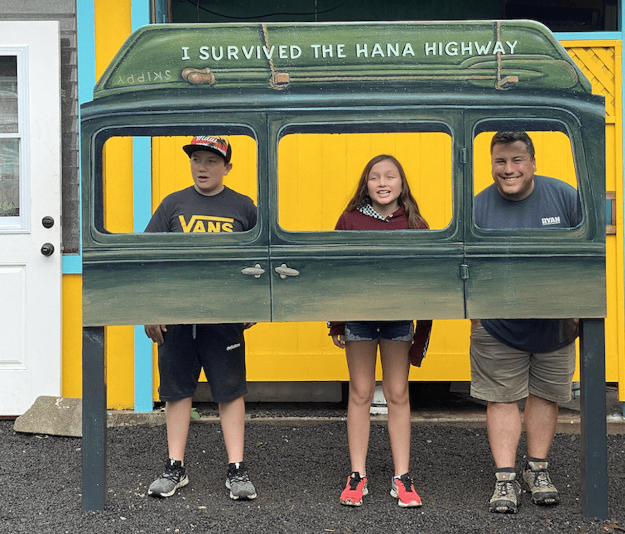 family posing in I Survived The Hana Highway car 