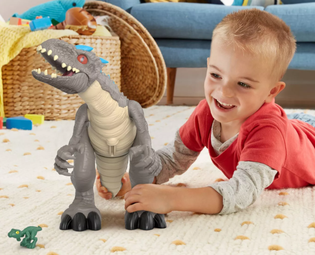 boy playing with a toy dinosaur