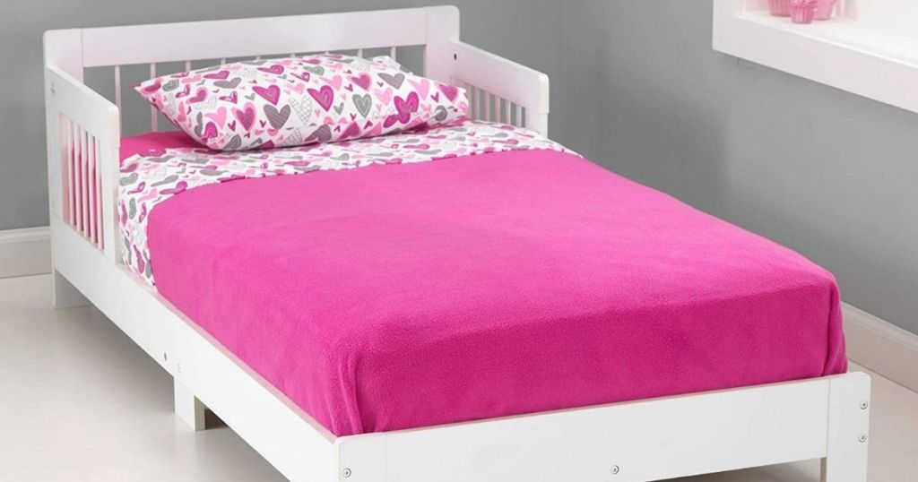 kids bed with pink bedding