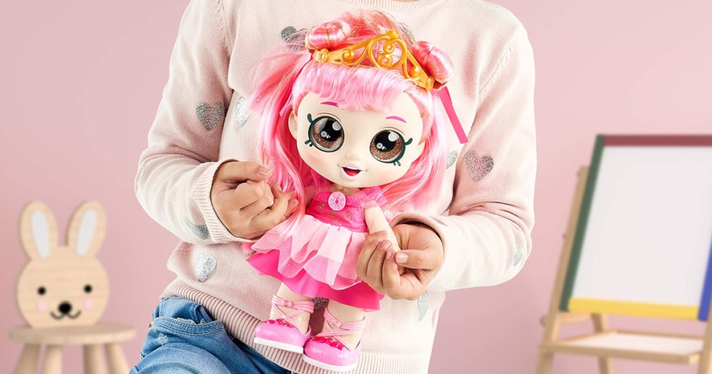 child holding a kind kids doll