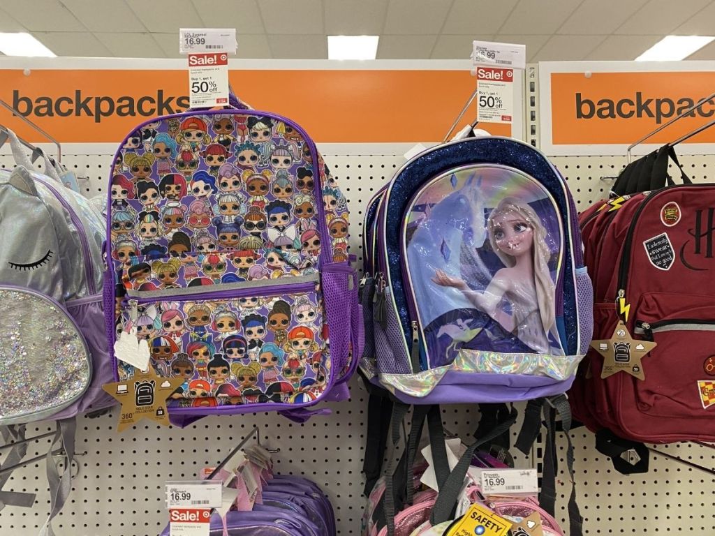 backpacks on shelf at store 