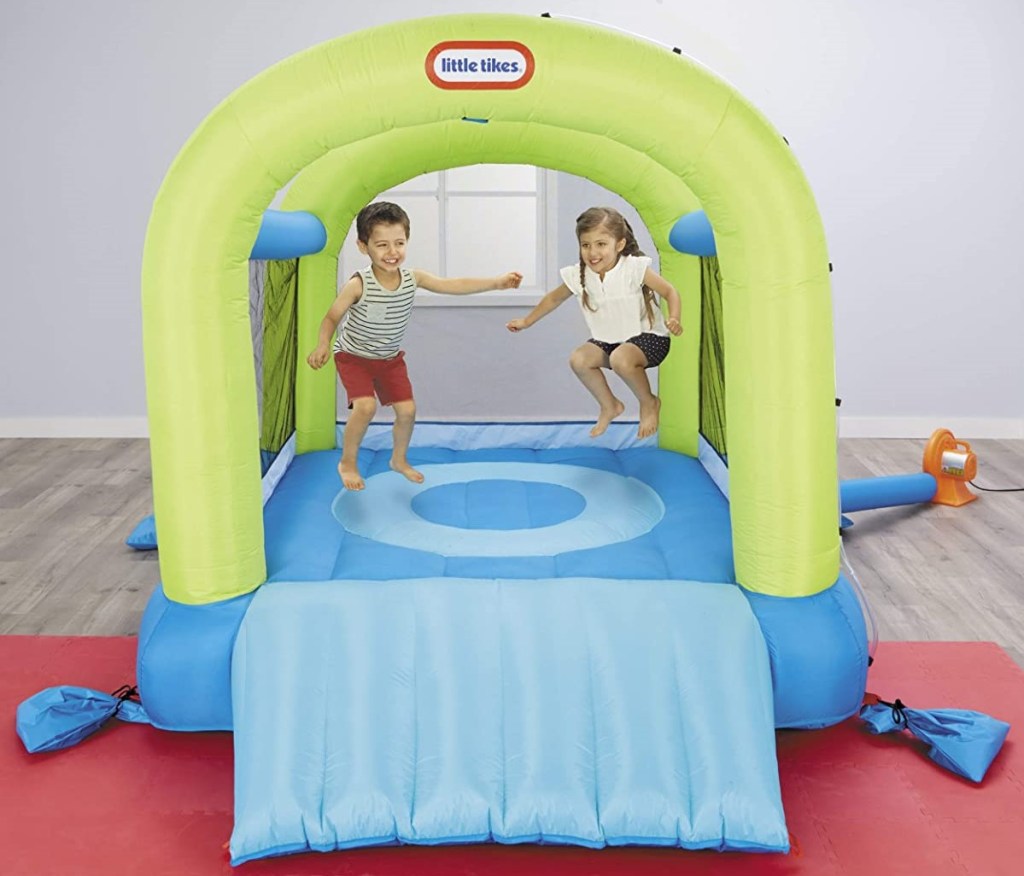 kids jumping in an inflatable bouncer