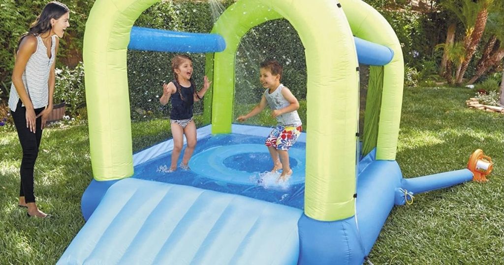 kids jumping on an inflatable bouncer
