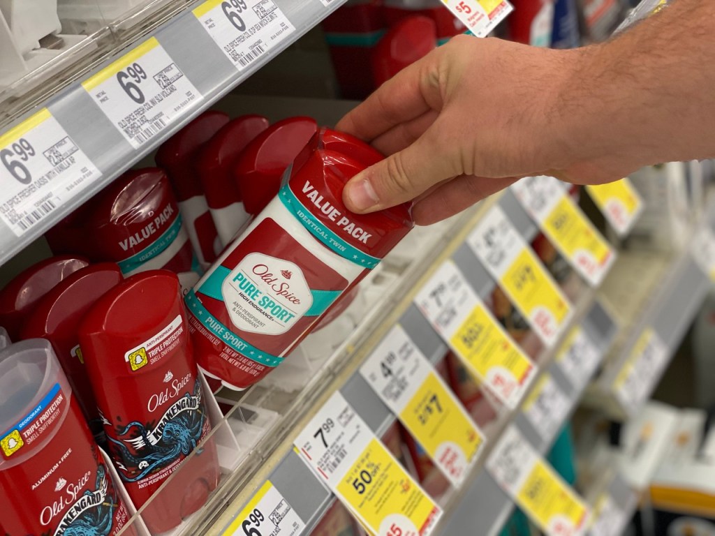 Man pulling Old Spice Deodorant from shelf