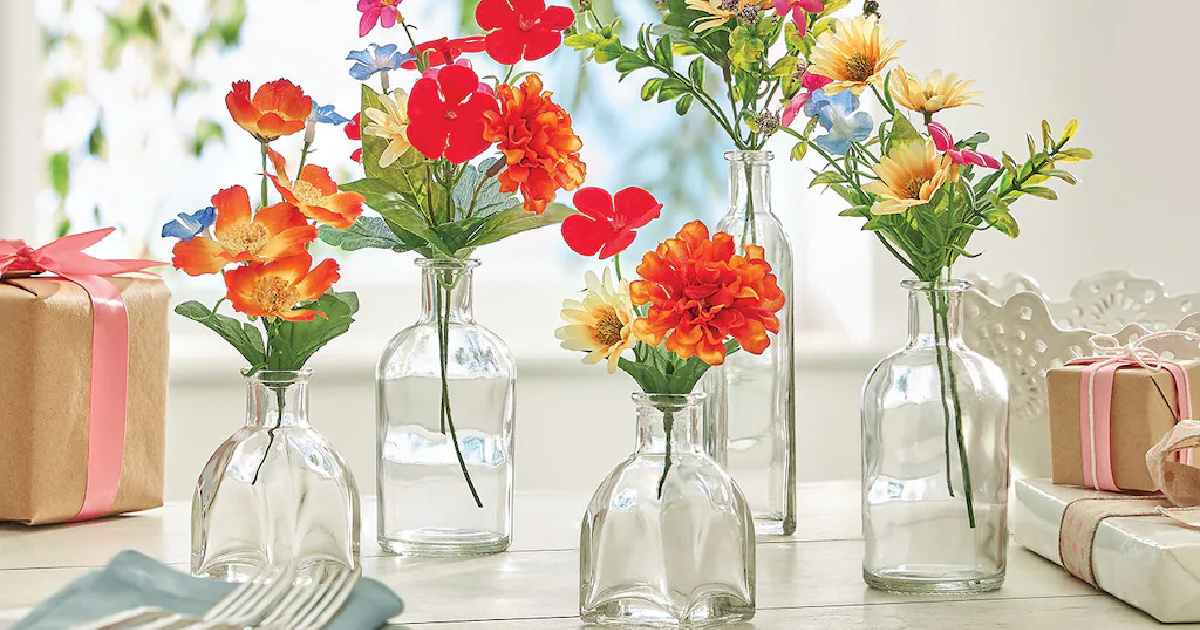 variety of glass vases with flowers