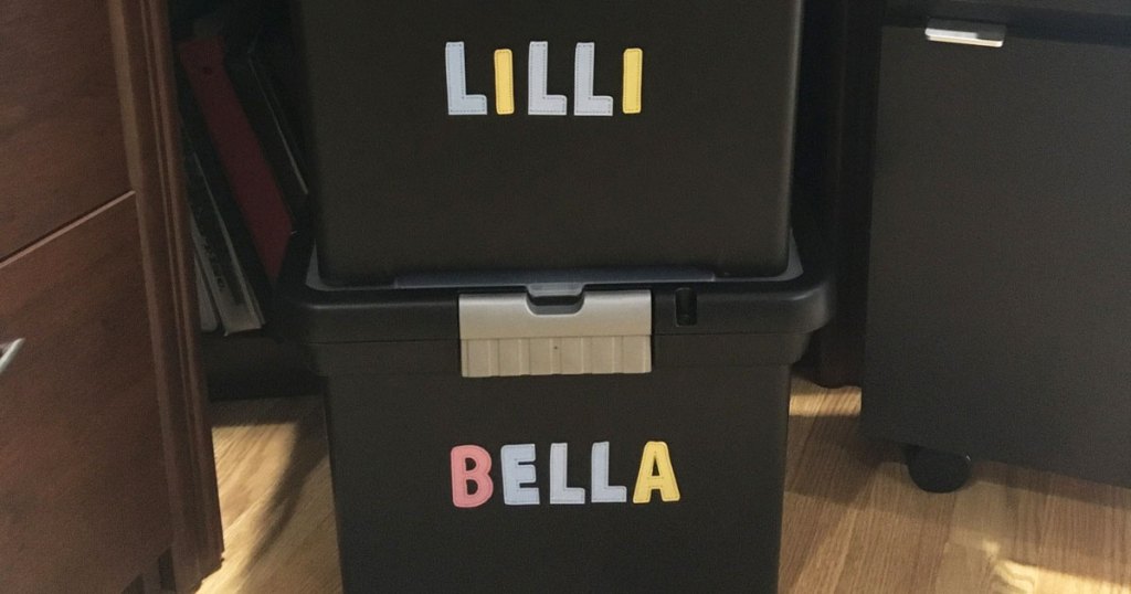 black file boxes with names on them