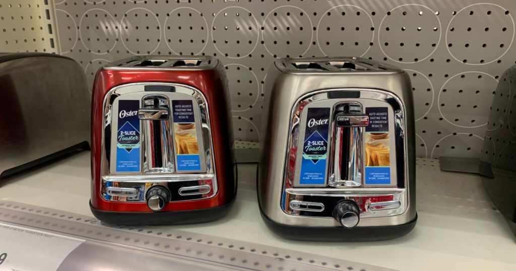 red and silver toaster on shelf