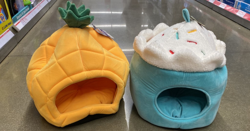pineapple and cupcake pet beds in aisle