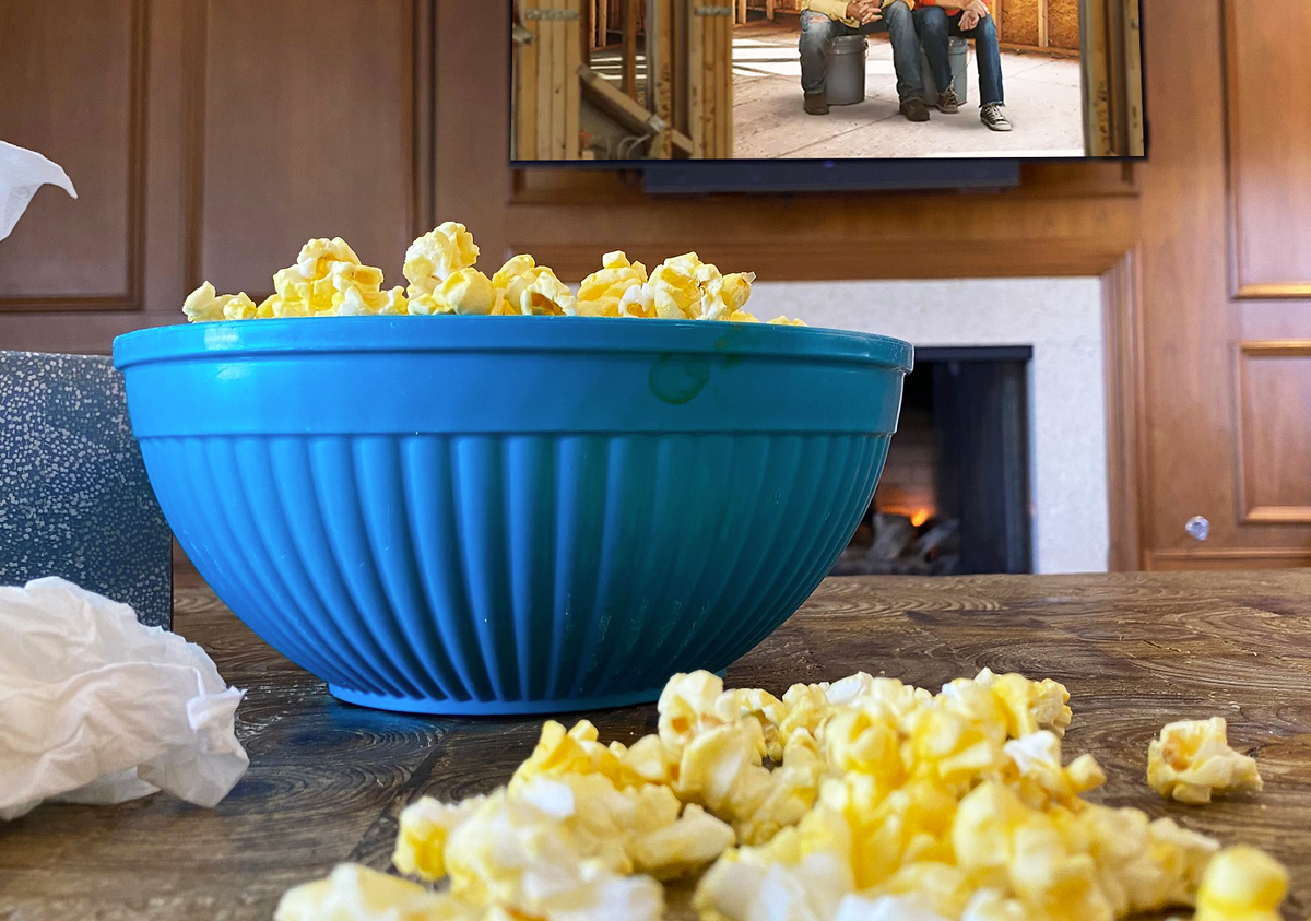 bowl of popcorn in front of tv