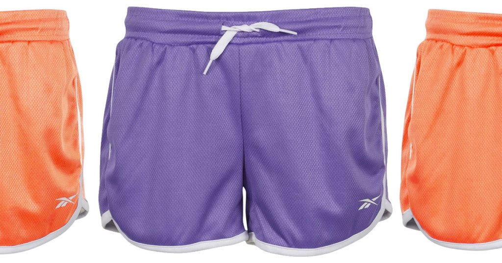girls reebok shorts in purple and orange