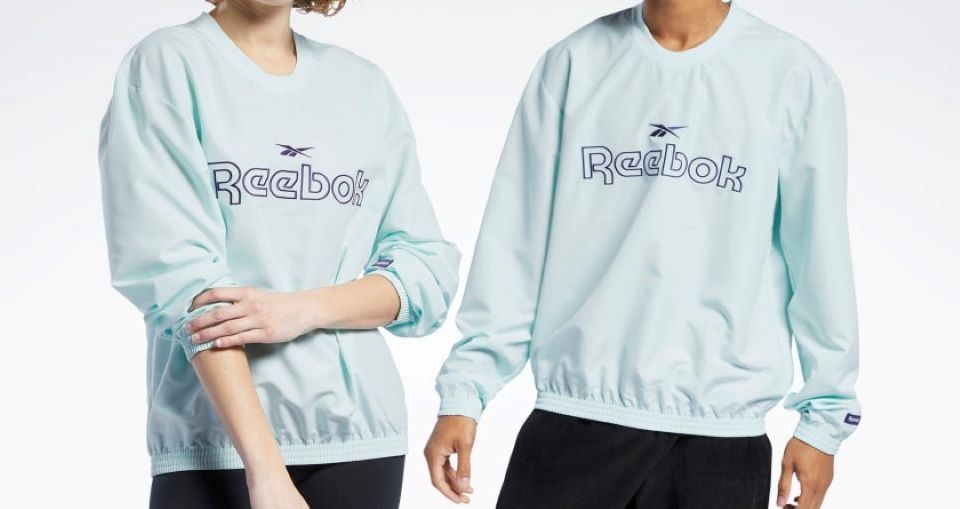 two people wearing Reebok sweatshirts