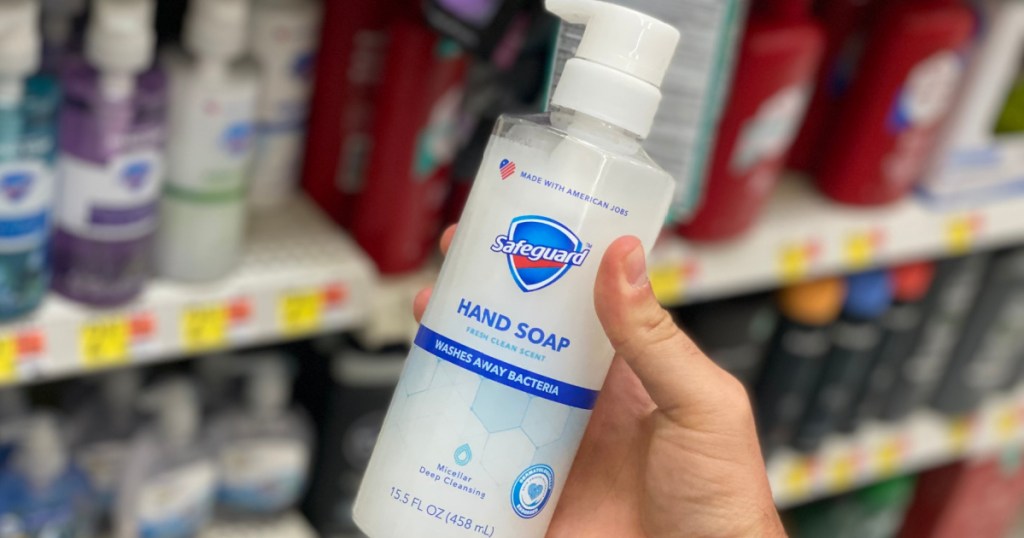 hand holding bottle of hand soap in store