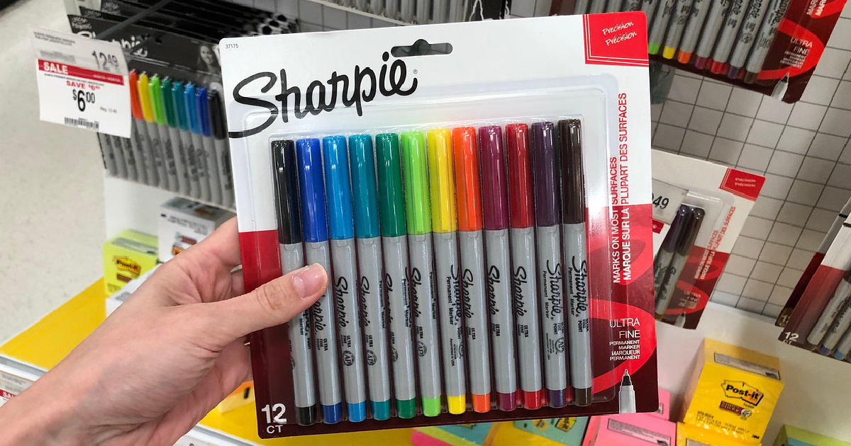 hand holding a pack of sharpie colorful markers