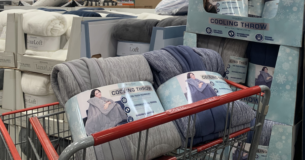 two cooling blankets in the basket of a costco shopping cart
