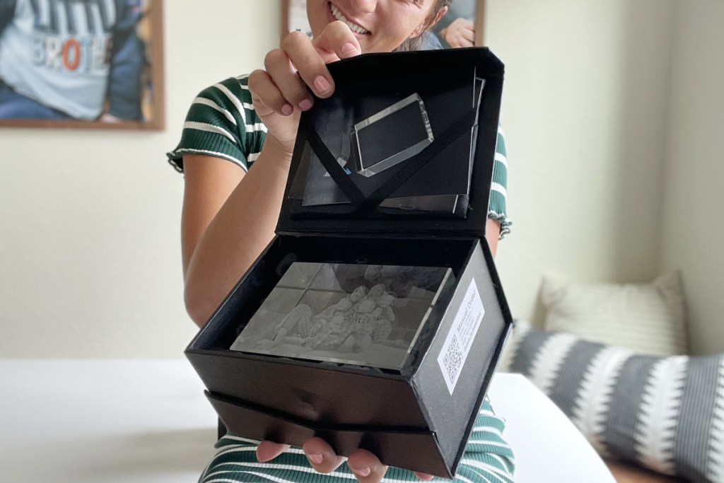 woman holding artpix 3d crystal photo box opened
