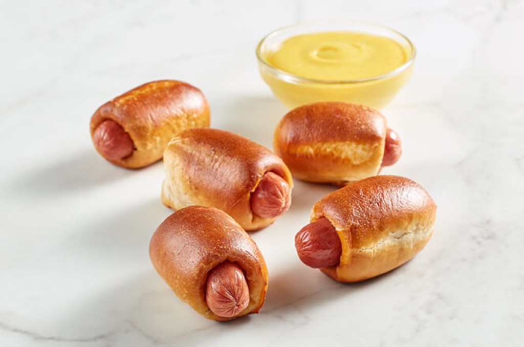 5 mini hot dogs wrapped in pretzel dough