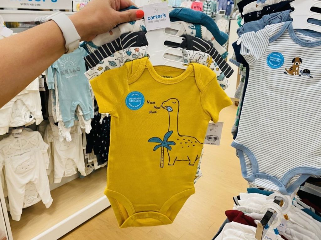 hand holding Carter's 5-pack of bodysuits