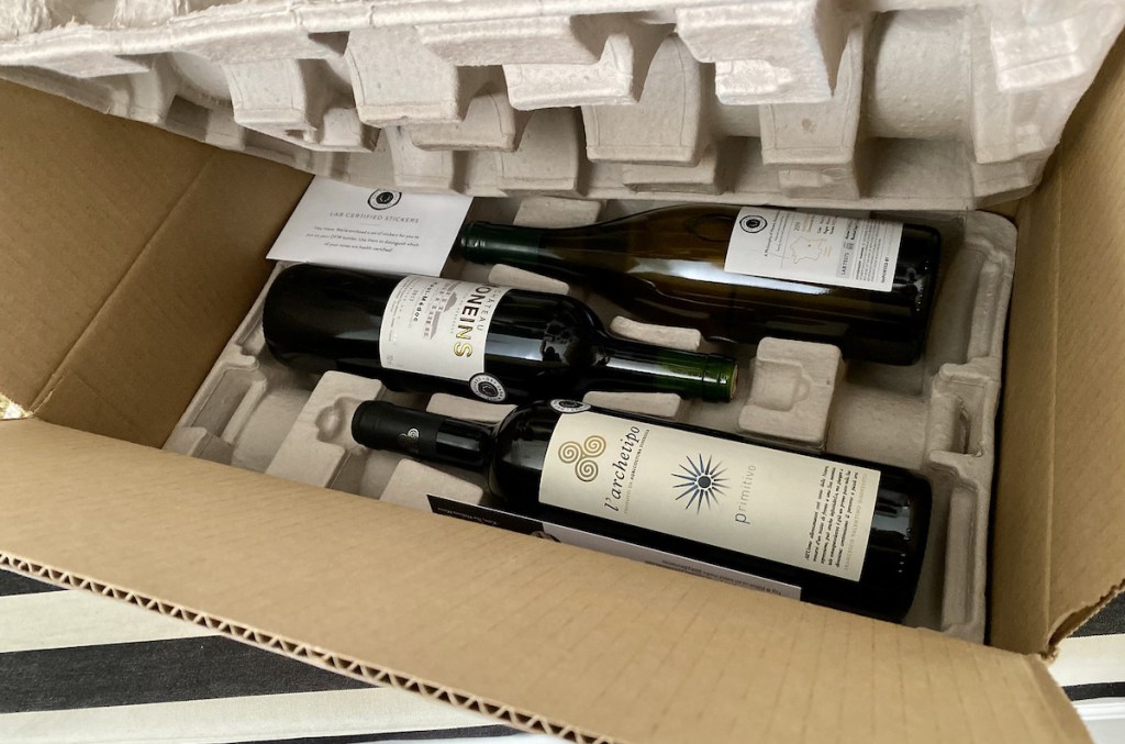inside of box with bottles of red wine