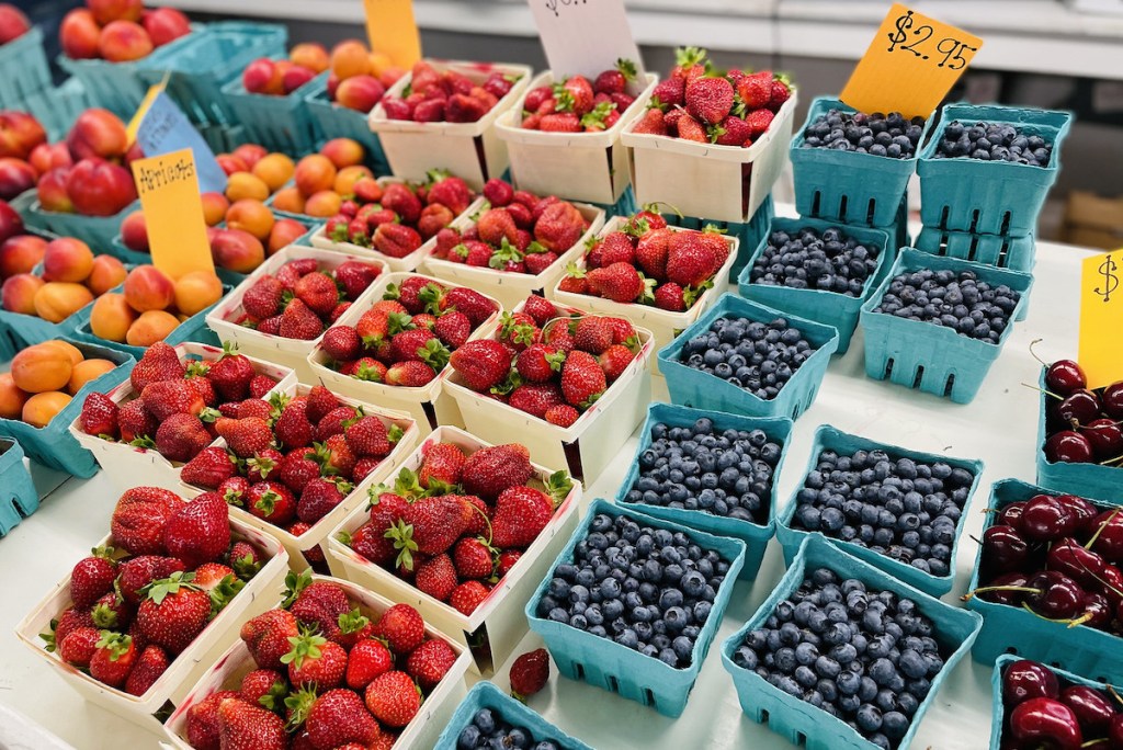 various baskets of fruit at farmers market