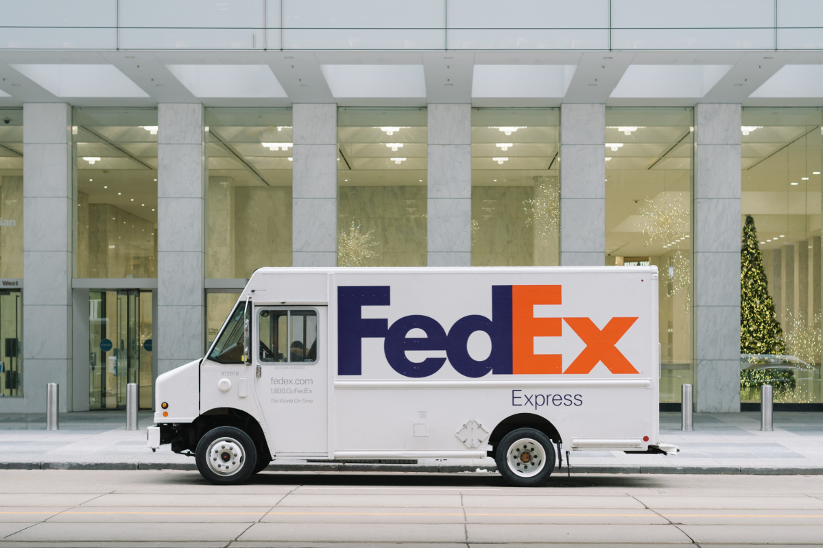 FedEx truck in front of building which is an employer with jobs that pay for college