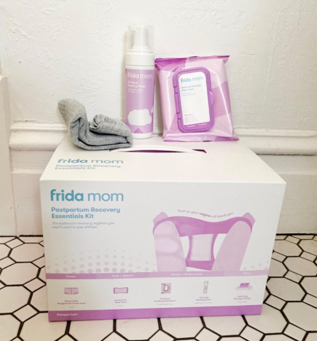 frida mom postpartum kit sitting on tile floor - gifts for new moms