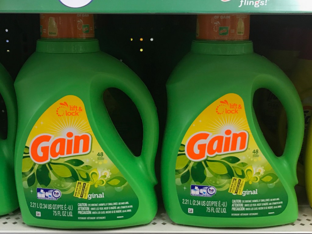 2 bottles of gain laundry detergent on store shelf