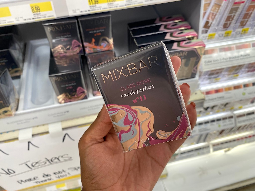 holding Mix Bar perfume in Target 