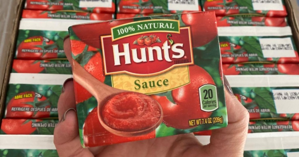 hunt's tomato sauce carton in hand