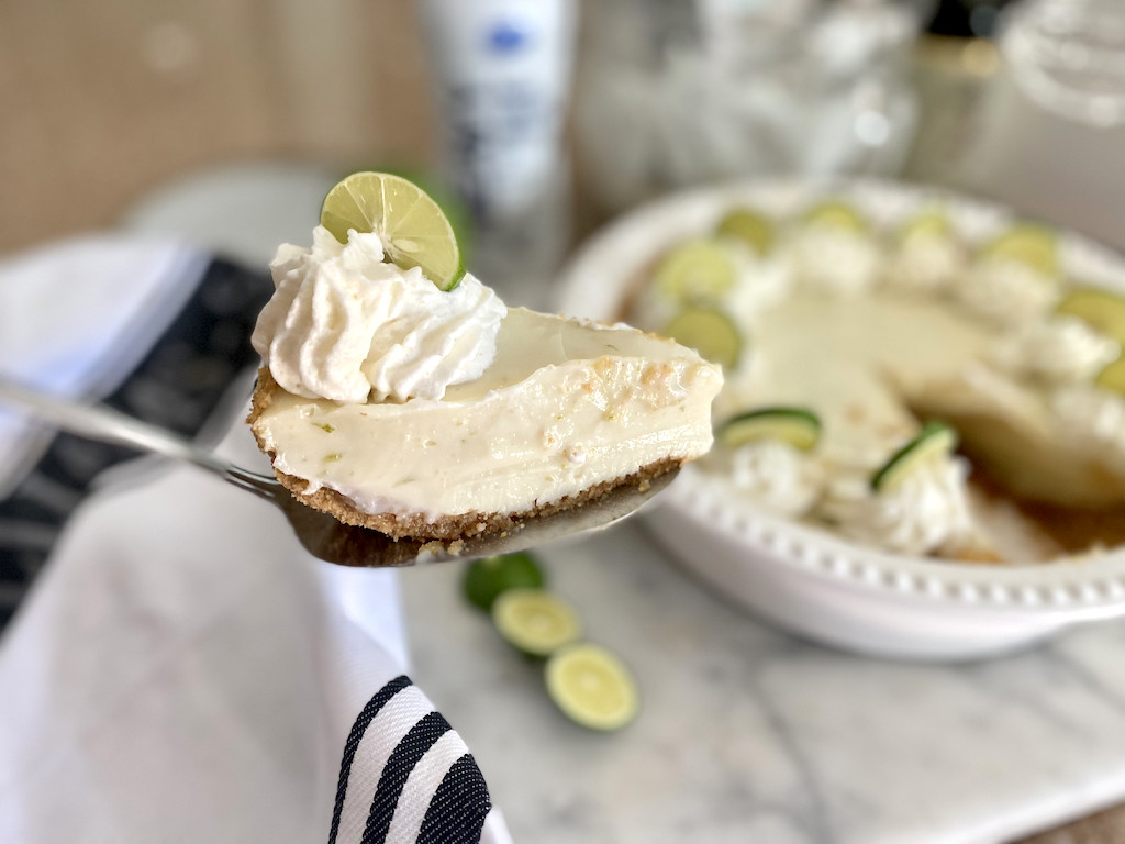 taking out slice of keto key lime pie 