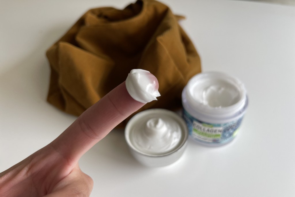 maryann organics collagen cream on finger