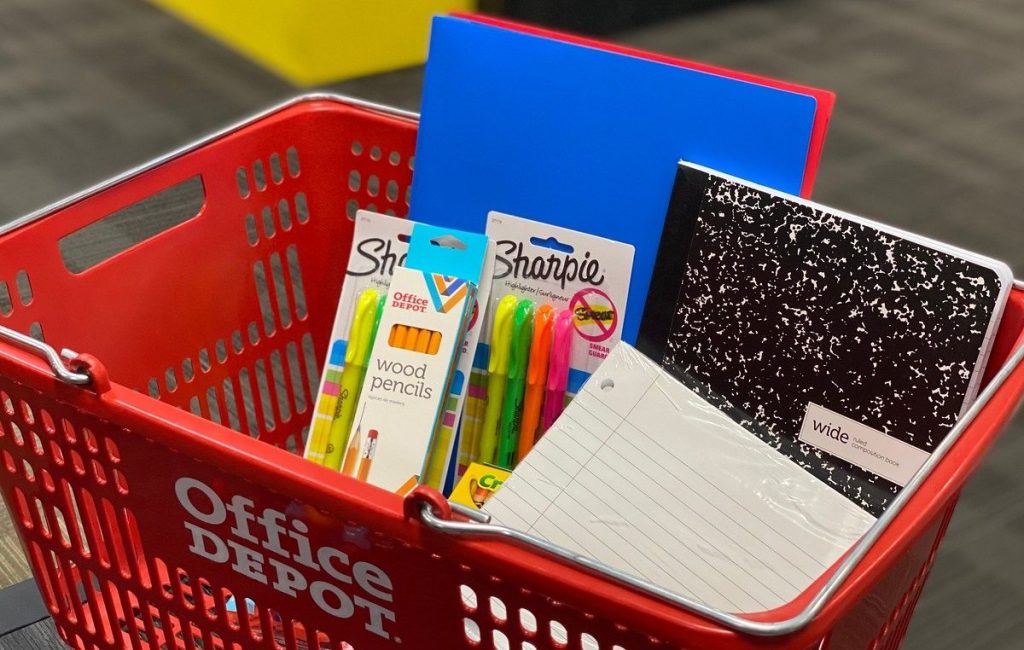 school supplies in red shopping basket
