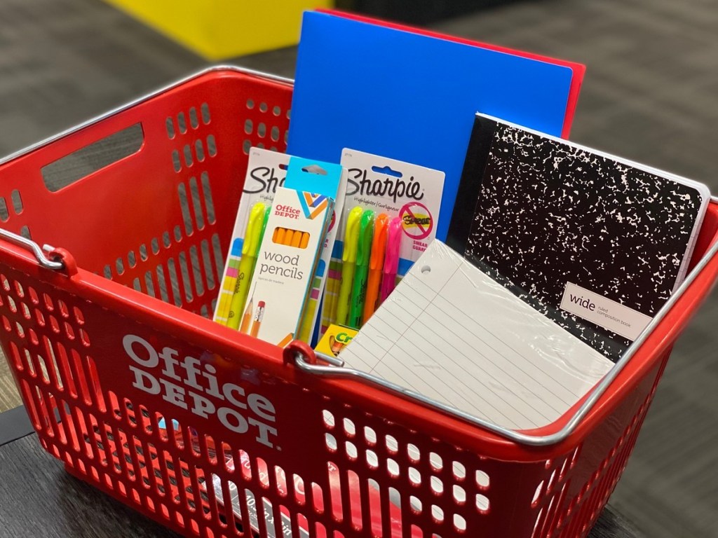 school supplies in red shopping basket